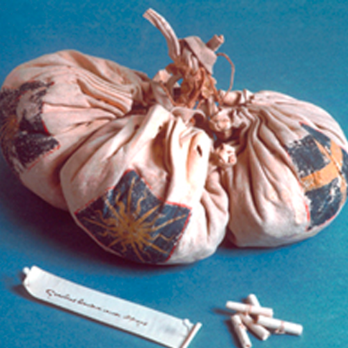 small roughspun bags tied with ropes and decorated with suns